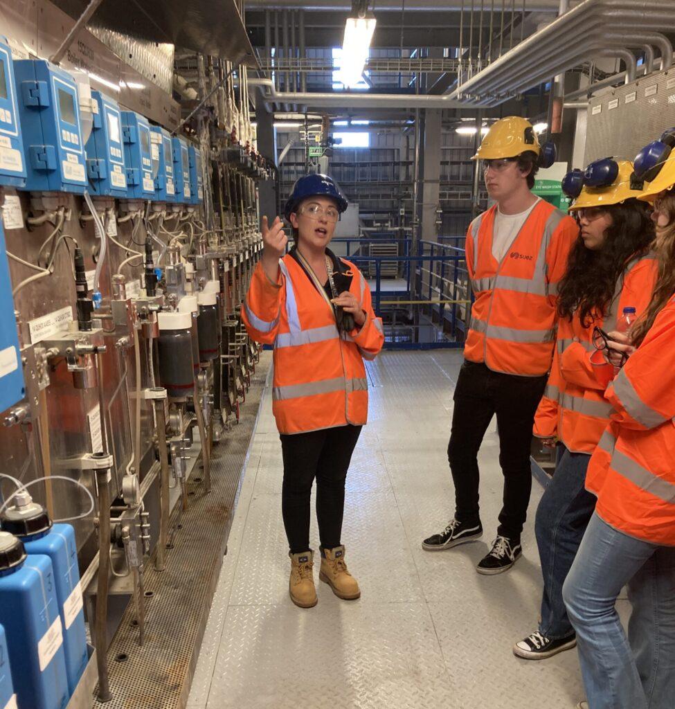 Woman engineer giving a tour of a facility